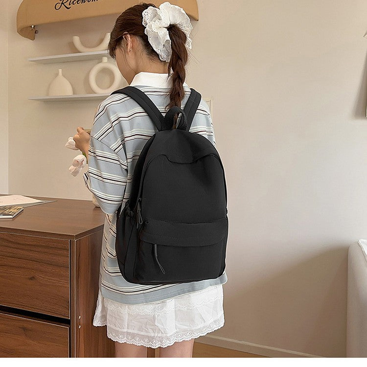 Casual Backpack with Flexible Side Pockets and Organized Structure
